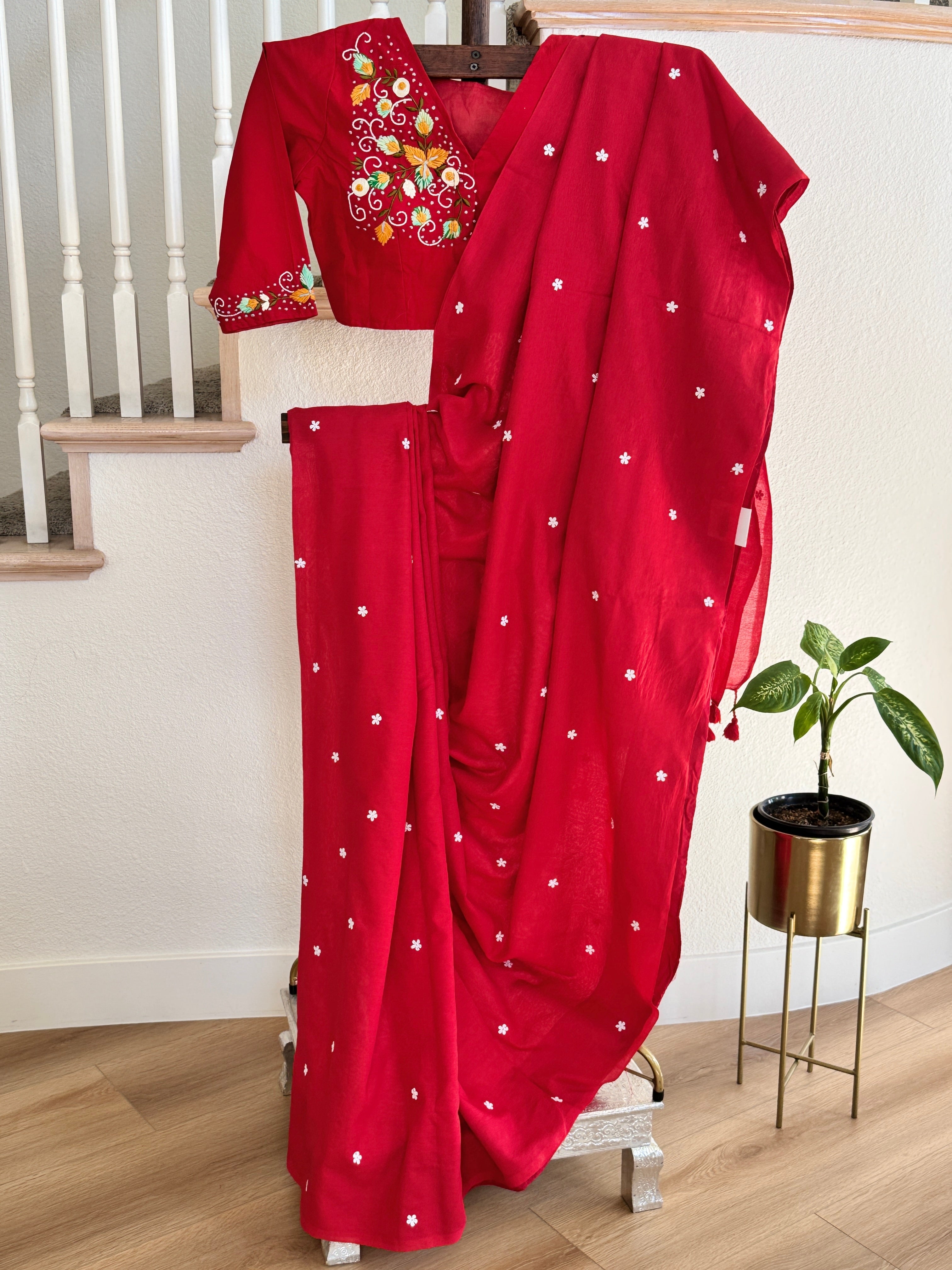 Red cotton saree with small white flowers