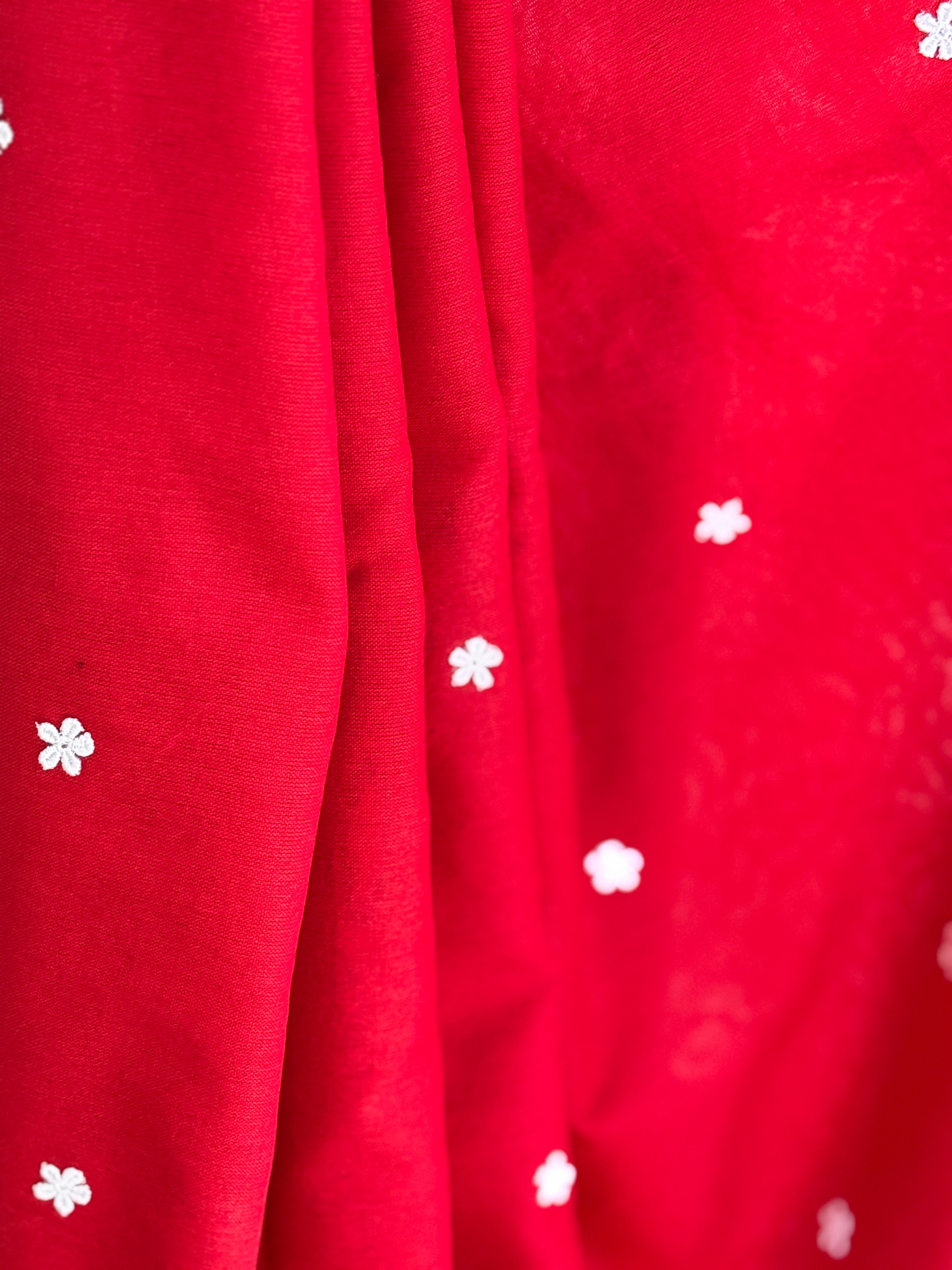 Red cotton saree with small white flowers
