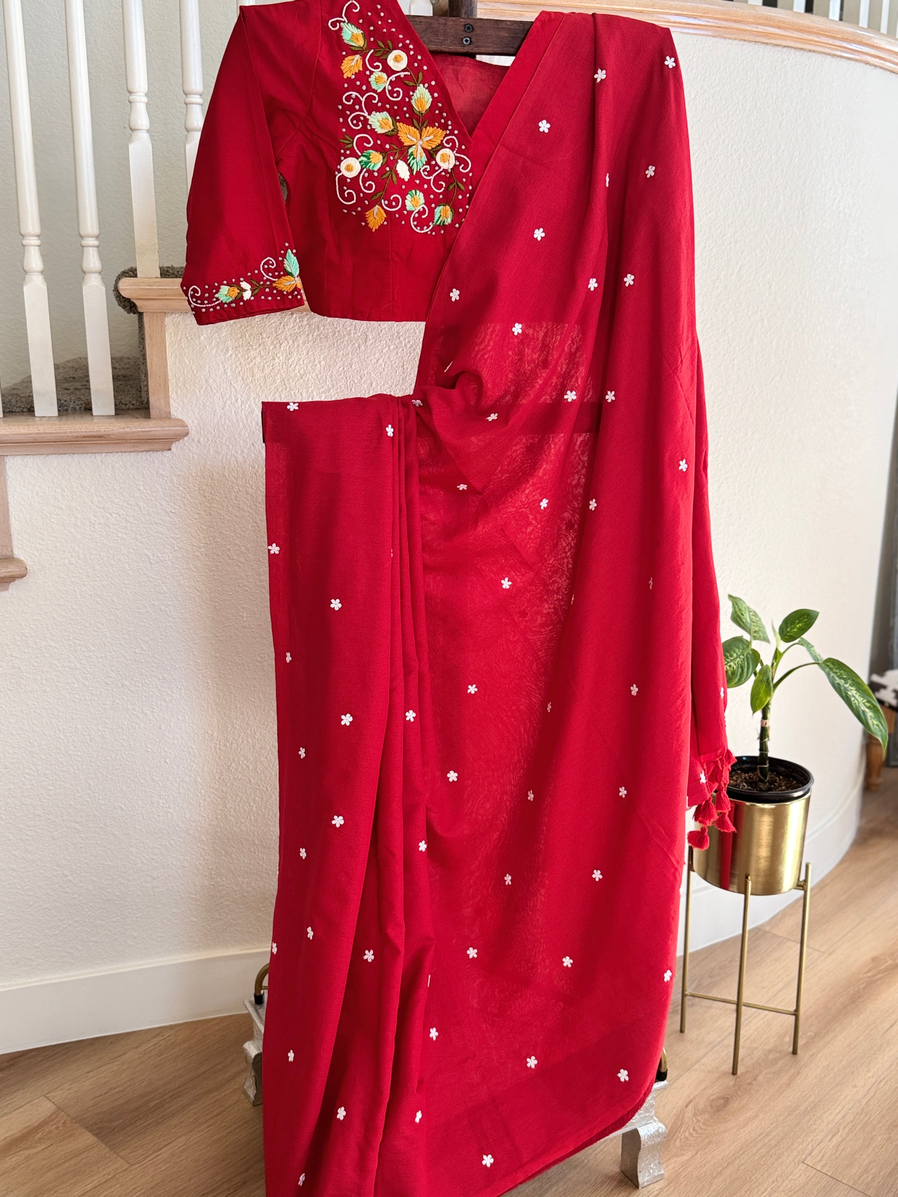 Red cotton saree with small white flowers