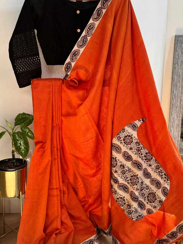Orange cotton saree with mango border and pallu